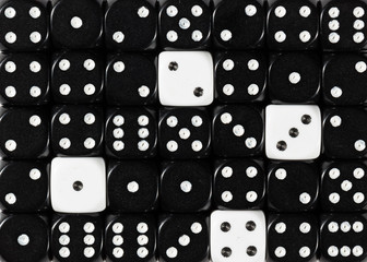 Background of random ordered black dices with four white cubes