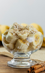 close up on glass jar with pieces of banana with oats