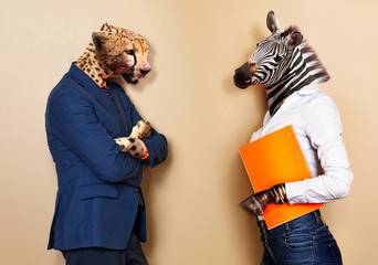 Boss and worker allegory with cheetah versus zebra