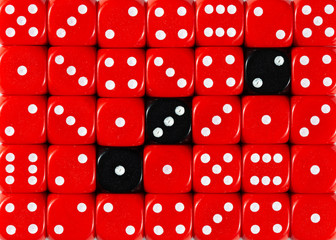 Background of random ordered red dices with three black cubes