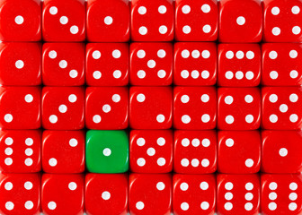 Background of random ordered red dices with one green cube