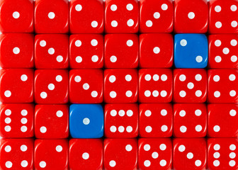 Background of random ordered red dices with two blue cubes