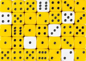 Background of random ordered yellow dices with six white cubes