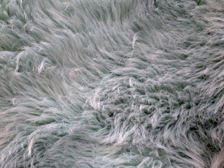 Imitation fur of bluish color with some and fluffiness.