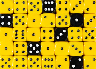 Background of random ordered yellow dices with six black cubes