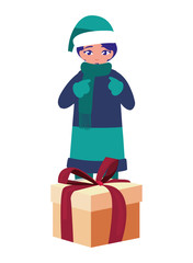 boy with winter clothes and christmas gifts