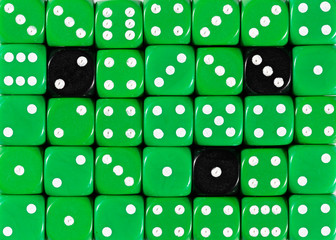 Background of random ordered green dices with three black cubes