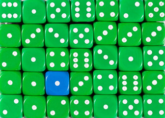 Background of random ordered green dices with one blue cube