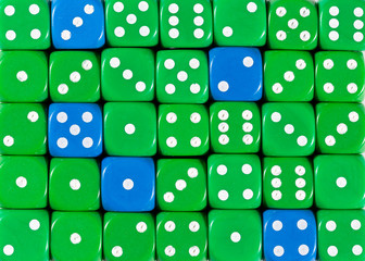 Background of random ordered green dices with five blue cubes