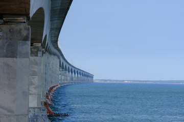 The confederation bridge spanning across  the northumberland strait to Prince Edward Island in Canada's Eastern province