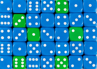 Background of random ordered blue dices with six green cubes