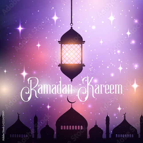 Ramadan Kareem background with hanging lantern and mosque silhouette