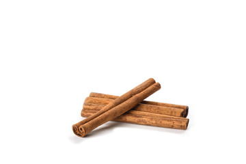 A few cinnamon sticks isolated on white background. Spice concept.