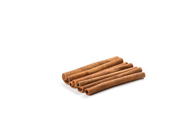 Four cinnamon sticks isolated on white background. Spice concept.