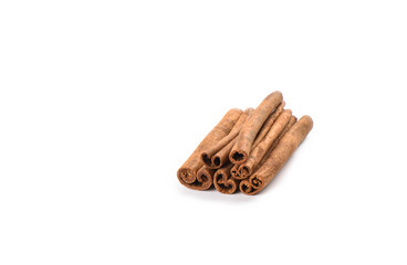 A few cinnamon sticks isolated on white background. Spice concept.
