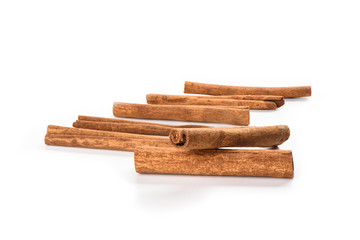 A few cinnamon sticks isolated on white background. Spice concept.
