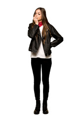 Fototapeta premium Full-length shot of Young woman with leather jacket having doubts on isolated white background