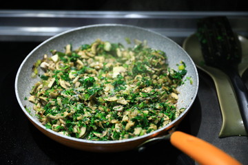 Pan-fried mushrooms with greens