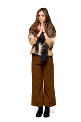 Fototapeta premium Full-length shot of Young hippie woman keeps palm together. Person asks for something on isolated white background