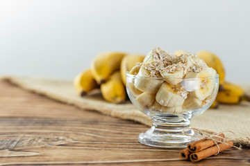 close up on glass jar with pieces of banana with oats