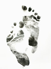 Imprint of  feet on white background