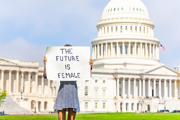 Protester holding feminist banner future is female