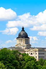 Obraz premium South Dakota Capitol Building under blue sky with clouds