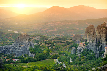 Naklejka premium Panoramic view of Meteora valley, a rock formation in central Greece hosting one of the largest complexes of Eastern Orthodox monasteries, built on immense natural pillars.