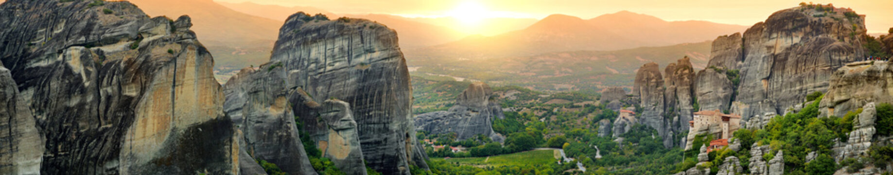 Panoramic view of Meteora valley, a rock formation in central Greece hosting one of the largest complexes of Eastern Orthodox monasteries, built on immense natural pillars.