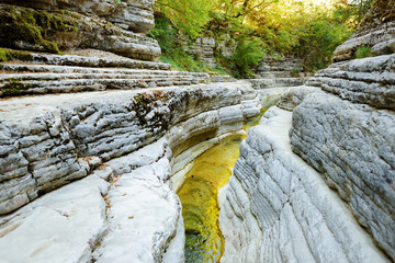 Papingo Rock Pools, also called ovires, natural green water pools located in small smooth-walled gorge near the village of Papingo in Zagori region, Greece.
