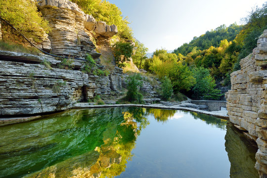 Papingo Rock Pools, also called ovires, natural green water pools located in small smooth-walled gorge near the village of Papingo in Zagori region, Greece.