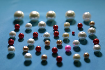 beads on colored background