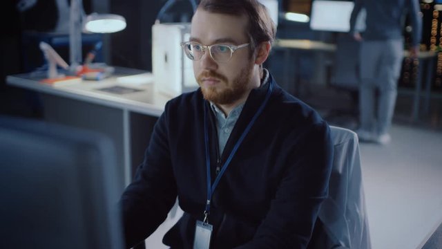 Professional Electronics Development Engineer Working on a Personal Computer in the Advanced Technology Designing Agency