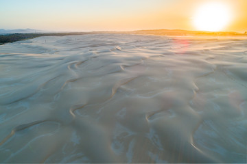 Sunrise over pristine white sand dunes