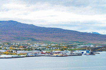 Beautiful scenery of Akureyri city from tourist viewpoint across the sea and Eyjafjordur fjord in iceland