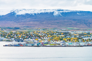 Fototapeta na wymiar Beautiful scenery of Akureyri city from tourist viewpoint across the sea and Eyjafjordur fjord in iceland