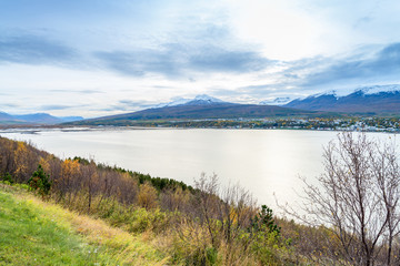 Beautiful scenery of Akureyri city from tourist viewpoint across the sea and Eyjafjordur fjord in iceland