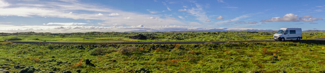 The Beautiful panorama view of blue sky and eldhraun lava field. The Green moss covered lava rock.