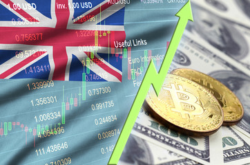 Fiji flag and cryptocurrency growing trend with two bitcoins on dollar bills