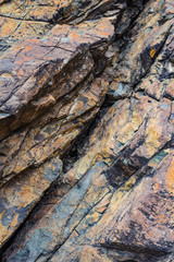 Colored stones on the beach Playa San Roque. Tenerife. Canary Islands..Spain