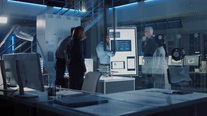 Engineers Meeting in Technology Research Laboratory: Engineers, Scientists and Developers Gathered Around Illuminated Conference Table, Talking and Finding Solution. Industrial Design Facility - Powered by Adobe