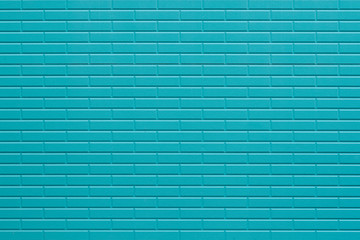Blue painted brick wall texture and background