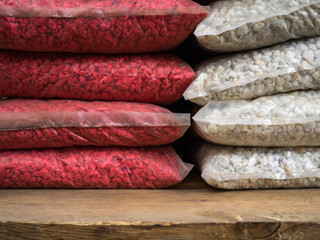 Multi-colored stones for decoration of a garden. Decorative gravel in on a counter of shop
