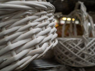 Empty wicker baskets with the handle. White baskets
