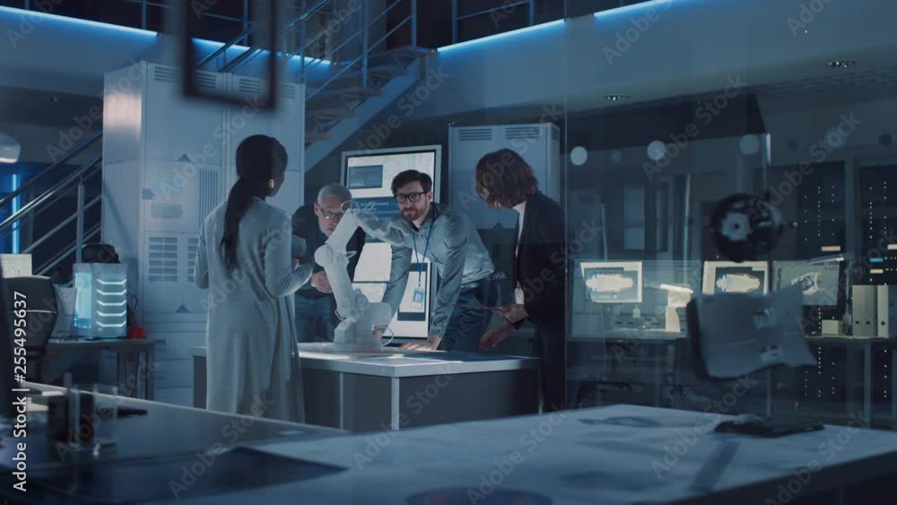 Aufkleber Engineers Meeting in Robotic Research Laboratory: Engineers, Scientists and Developers Gathered Around Illuminated Conference Table, Talking, Using Tablet and Analysing Design of Industrial Robot Arm