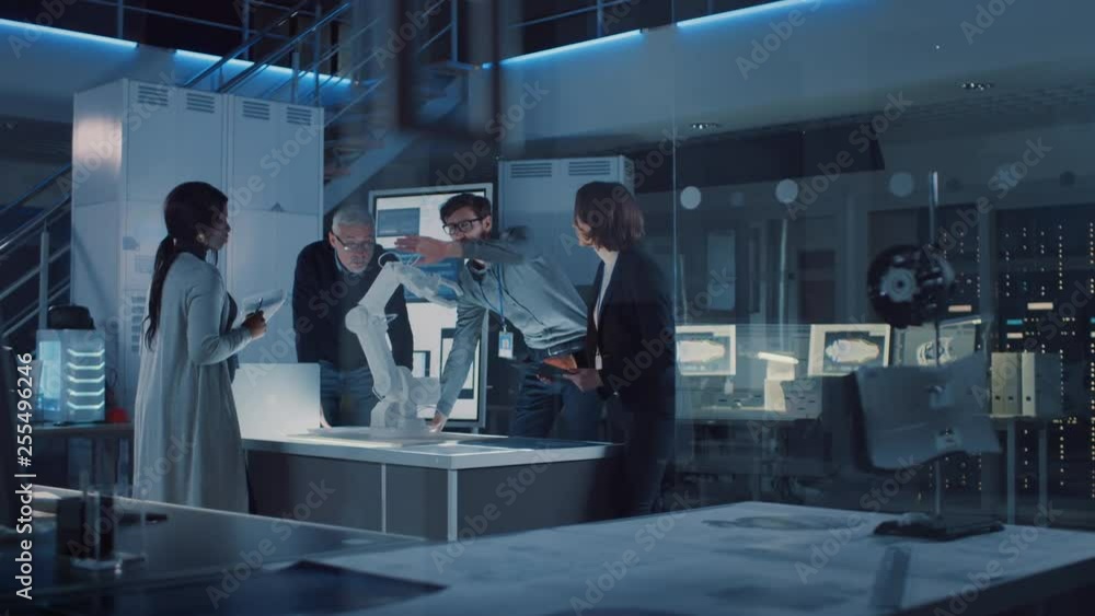 Poster engineers meeting in robotic research laboratory: engineers, scientists and developers gathered arou