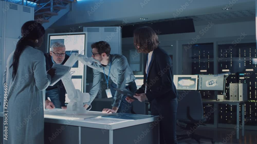 Aufkleber Engineers Meeting in Robotic Research Laboratory: Engineers, Scientists and Developers Gathered Around Illuminated Conference Table, Talking, Using Tablet and Analysing Design of Industrial Robot Arm
