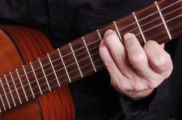 Fototapeta na wymiar Guitarist playing guitar. Close-up