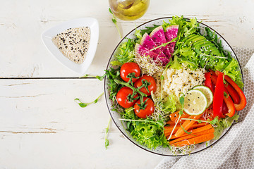 Couscous and vegetables bowl.  Trend food. Healthy, diet, vegetarian food concept on a light background . Vegan buddha bowl. Top view