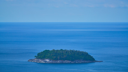 single island in the ocean from aerial view